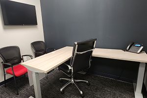 photo of the flex office with chair, desk, and phone
